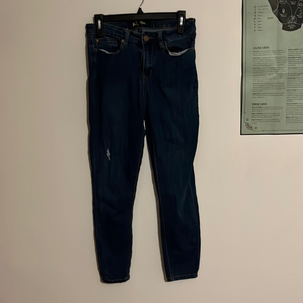 straight leg blue jeans with small rip